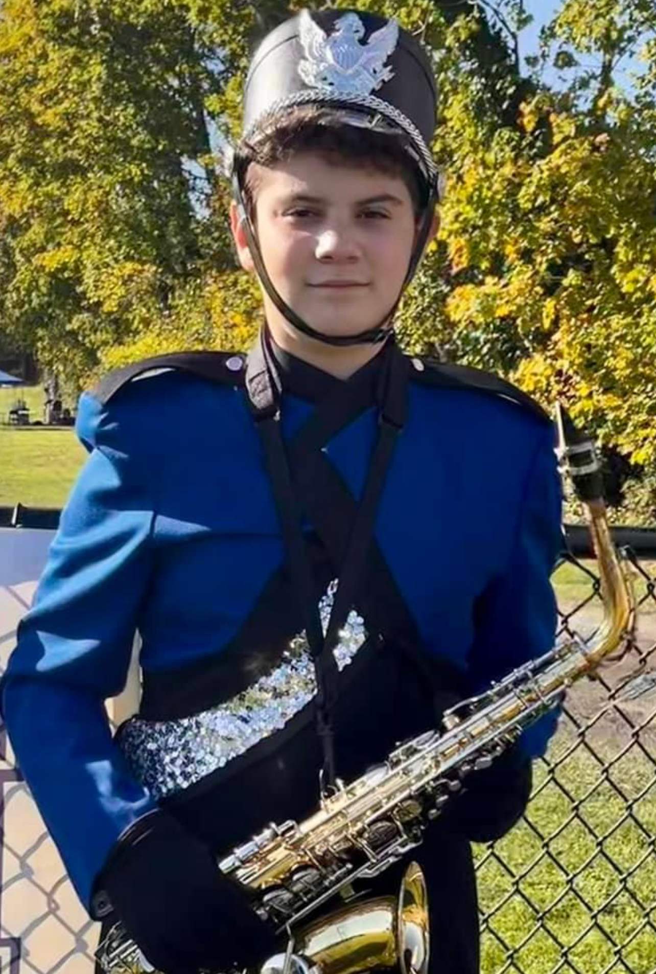 Ricardo in Blue Marching Band Uniform with Saxophone - Outdoor Portrait